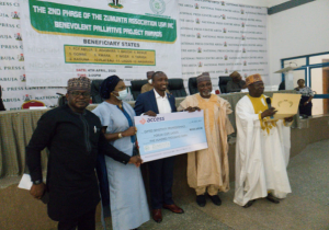 GSP Forum Awards podium with winners receiving trophies, surrounded by a celebratory audience, highlighting various categories in a vibrant setting sponsored by Zumunta.